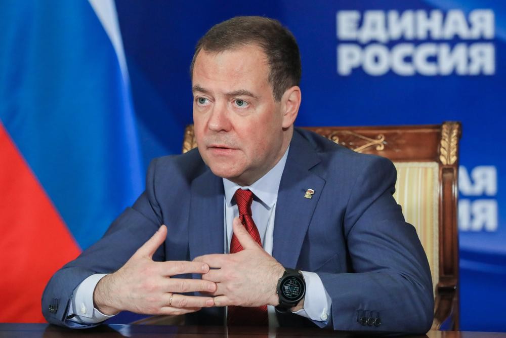 FILE - Russian Security Council Deputy Chairman and the head of the United Russia party Dmitry Medvedev chairs a meeting on saving businesses and jobs in foreign companies via video link at Gorki state residence, outside Moscow, Russia, on March 16, 2022. Dmitry Medvedev, the deputy head of Russia’s Security Council chaired by President Vladimir Putin, said Thursday, May 12, 2022 that growing Western arms supplies to Ukraine and training for its troops have “increased the probability that an ongoing proxy war will turn into an open and direct conflict between NATO and Russia. (Yekaterina Shtukina, Sputnik, Government Pool Photo via AP)